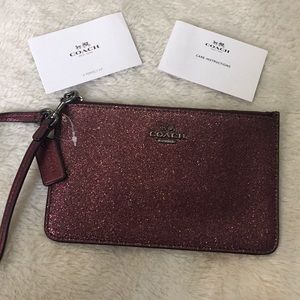Coach mini wristlet wallet.